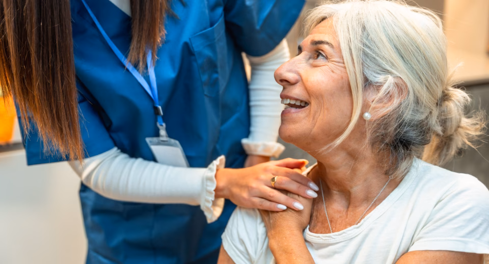 A technician comforts a patient