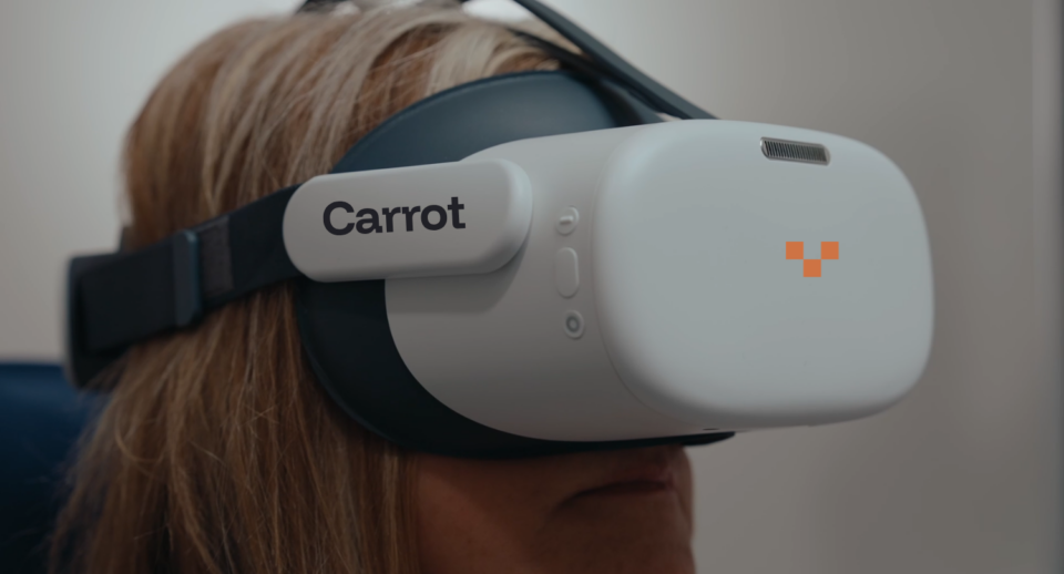 A woman taking a VR Kinetic Perimetry Test