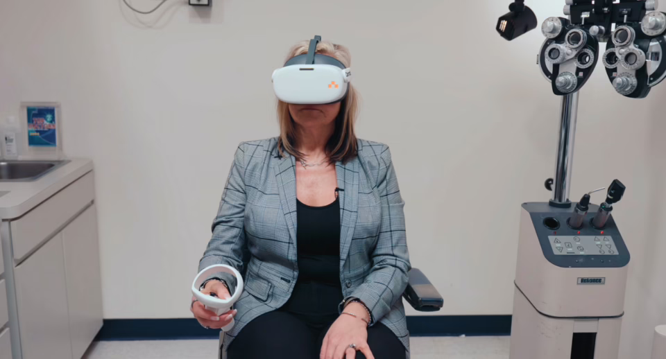 A patient comfortably takes a visual field test with Carrot