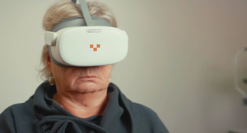 A woman takes a virtual visual field test with Carrot