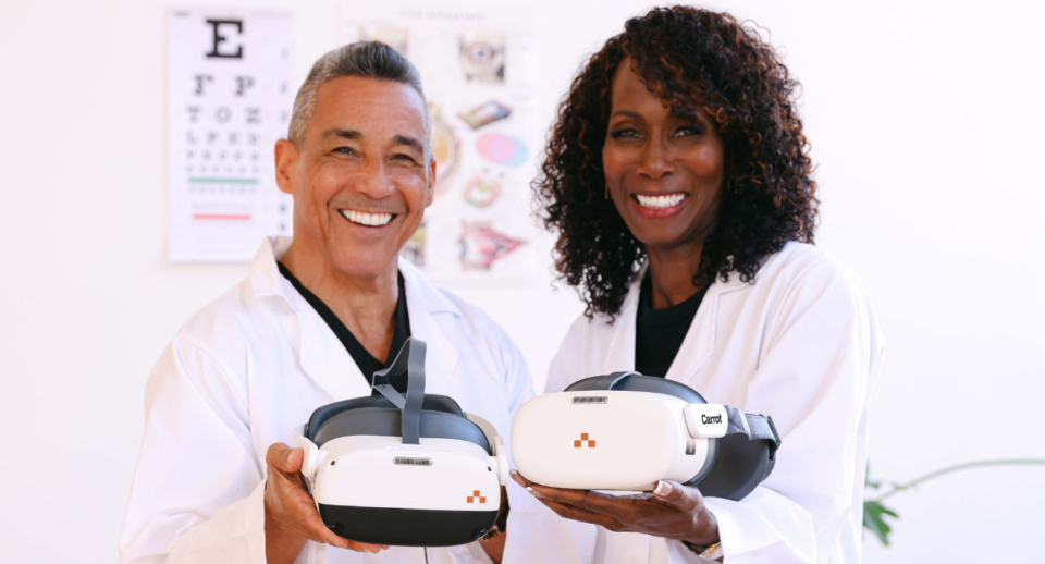 Two medical optometrists hold Carrot Headsets