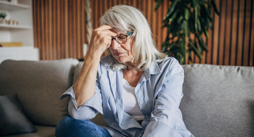 A concerned senior woman