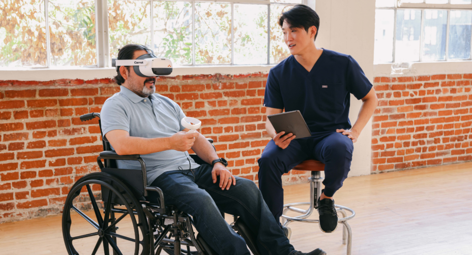 A patient in a wheel chair takes a visual field test with Carrot