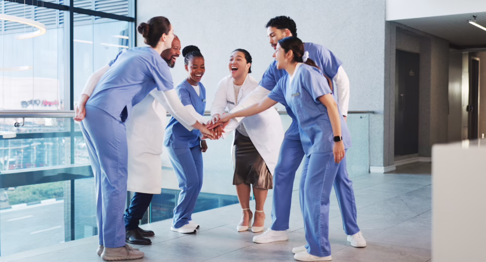 a medical team celebrates together